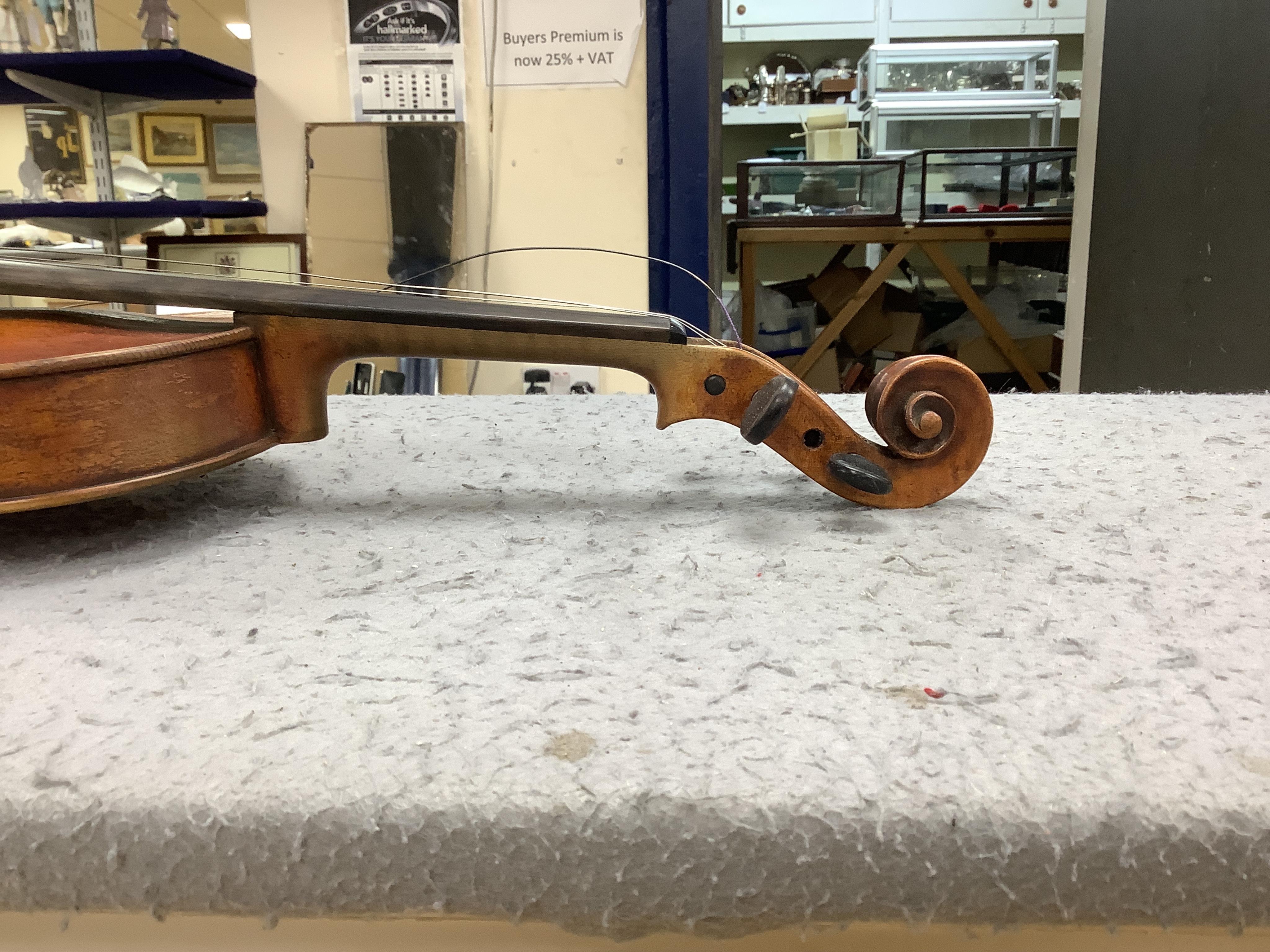 A late 19th cased century French unmarked violin and bow, body 35cm high.